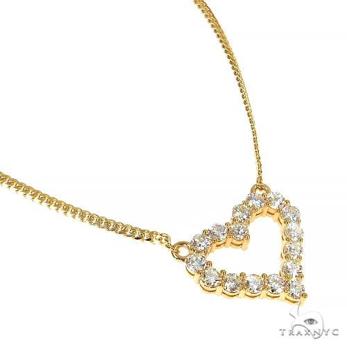 Yellow gold Miami Cuban chain necklace with diamond-studded open heart pendant