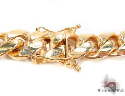 10k yellow gold solid Miami Cuban link chain, 15.5mm wide, polished finish.