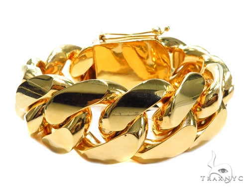 Yellow gold Miami Cuban link bracelet with thick, polished chain and secure clasp