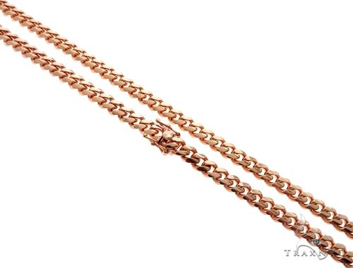 7mm Miami Cuban link chain in 14k rose gold, 24 inches — close-up showing interlocking links and warm rose tone