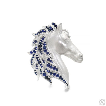 Silver stallion pendant with blue gemstone mane, detailed horse head design.