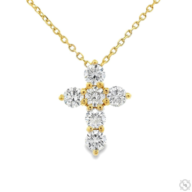 Mini diamond cross pendant set in yellow gold with round prong-set stones, front view