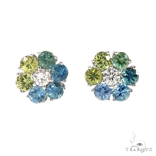 Cluster flower earrings with blue, green sapphires, and clear gemstone accents