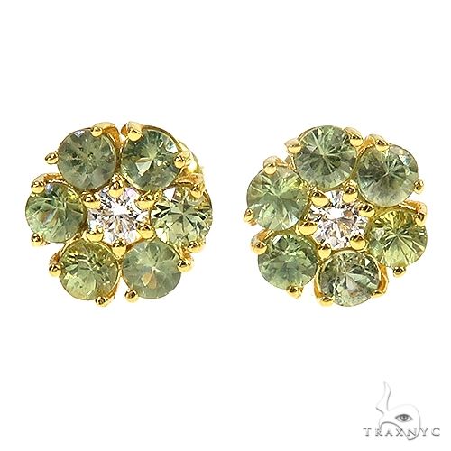 Yellow gold flower cluster earrings with green sapphires and central diamond accents