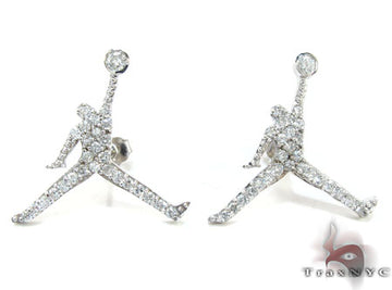 White Jordan Jumpman stud earrings with clear rhinestone detailing, men's style.