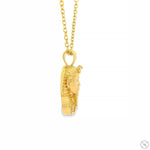 14K yellow gold mini Pharaoh pendant with detailed face and chain necklace.
