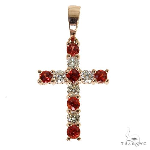 Mini gold cross pendant with red sapphires and small round diamonds