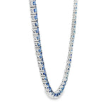 White gold tennis chain necklace with round blue sapphire gemstones, elegant and classic design.