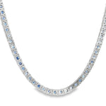 White gold tennis chain necklace with round blue sapphire gemstones, elegant and classic design.
