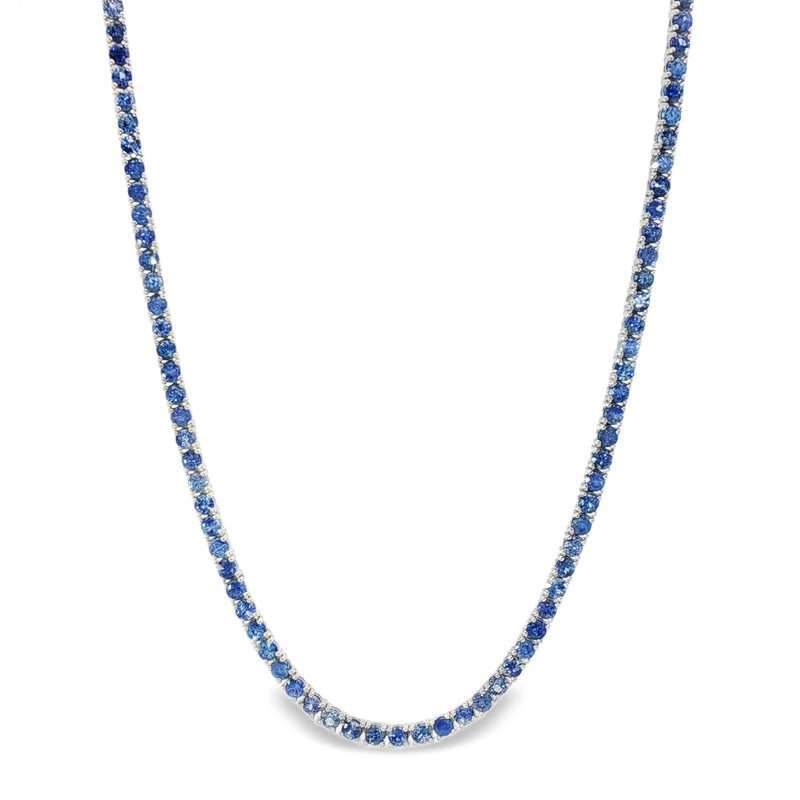 White gold tennis chain necklace with round blue sapphire gemstones, elegant and classic design.