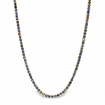 White gold tennis chain necklace with round blue sapphire gemstones, elegant and classic design.
