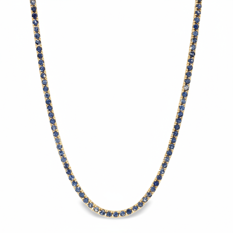 White gold tennis chain necklace with round blue sapphire gemstones, elegant and classic design.