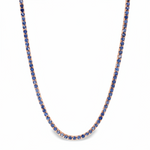 White gold tennis chain necklace with round blue sapphire gemstones, elegant and classic design.