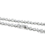 White gold diamond tennis chain with multi-shaped stones in a continuous link design.