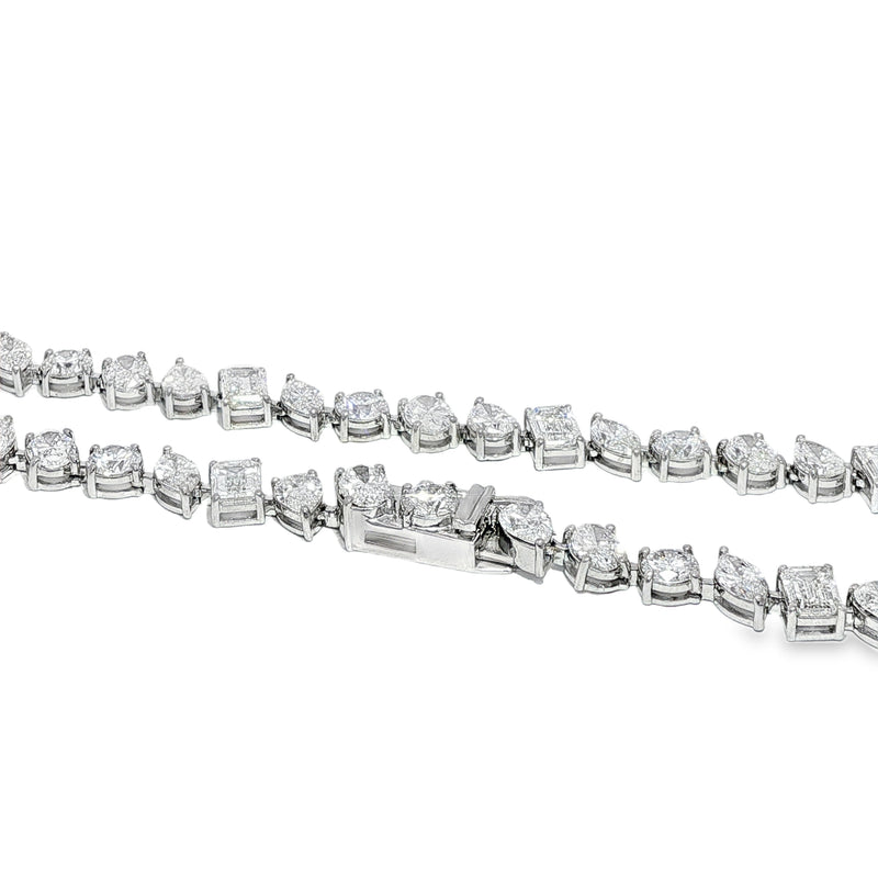 White gold diamond tennis chain with multi-shaped stones in a continuous link design.