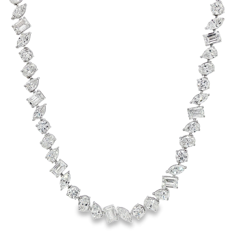 White gold diamond tennis chain with multi-shaped stones in a continuous link design.