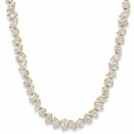 White gold diamond tennis chain with multi-shaped stones in a continuous link design.