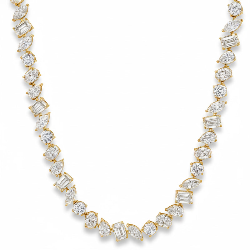 White gold diamond tennis chain with multi-shaped stones in a continuous link design.