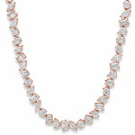 White gold diamond tennis chain with multi-shaped stones in a continuous link design.
