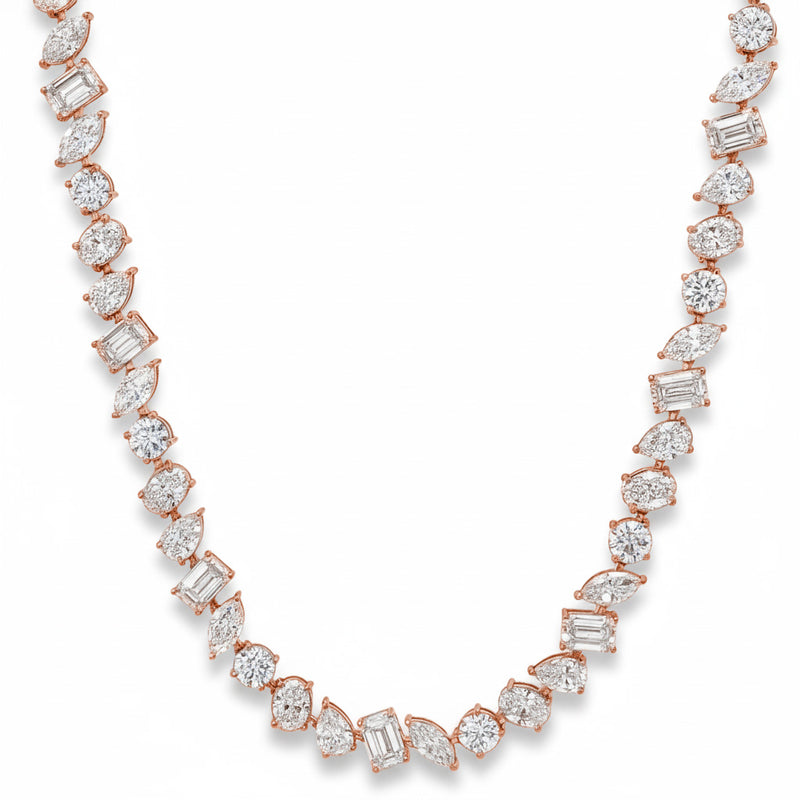 White gold diamond tennis chain with multi-shaped stones in a continuous link design.