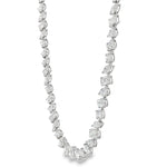 White gold diamond tennis chain with multi-shaped stones in a continuous link design.