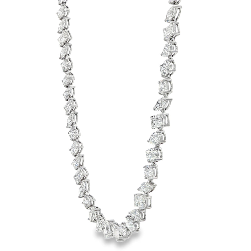 White gold diamond tennis chain with multi-shaped stones in a continuous link design.