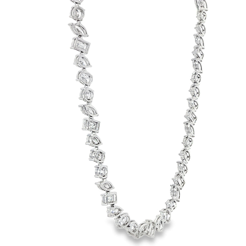 White gold diamond tennis chain with multi-shaped stones in a continuous link design.