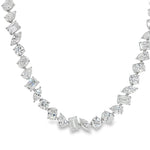 White gold diamond tennis chain with multi-shaped stones in a continuous link design.