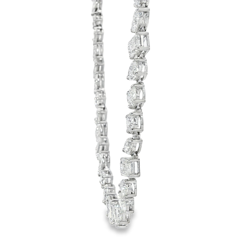 White gold diamond tennis chain with multi-shaped stones in a continuous link design.
