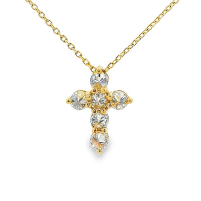 Yellow gold upside-down cross necklace with clear and yellow diamonds in a cluster design.