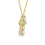 Yellow gold upside-down cross necklace with clear and yellow diamonds in a cluster design.