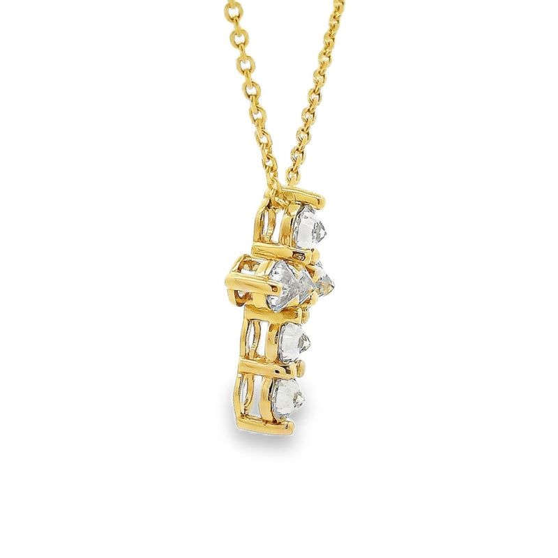 Yellow gold upside-down cross necklace with clear and yellow diamonds in a cluster design.
