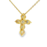 Yellow gold upside-down cross necklace with clear and yellow diamonds in a cluster design.