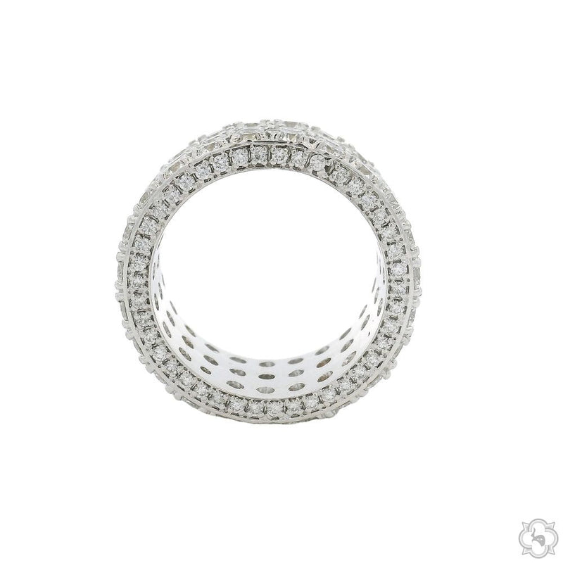 Wide white gold eternity band with three rows of natural round diamonds