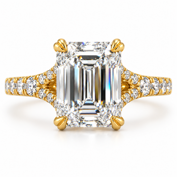 Emerald cut diamond engagement ring on a split shank in polished 14K yellow gold