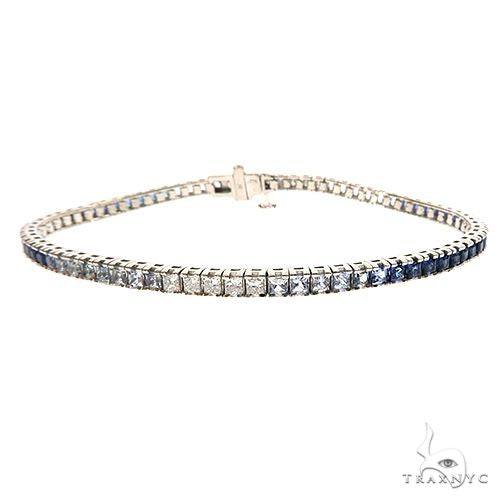 White gold tennis bracelet with round sapphire gemstones in a classic continuous setting