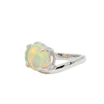 Silver pinky ring with oval opal gemstone and sleek bypass band design.