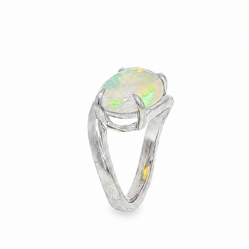 Silver pinky ring with oval opal gemstone and elegant bypass band design.