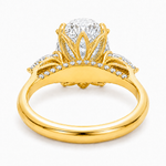 Oval three stone engagement ring with oval lab grown diamond, double claw prongs, tulip basket, and pear side diamonds
