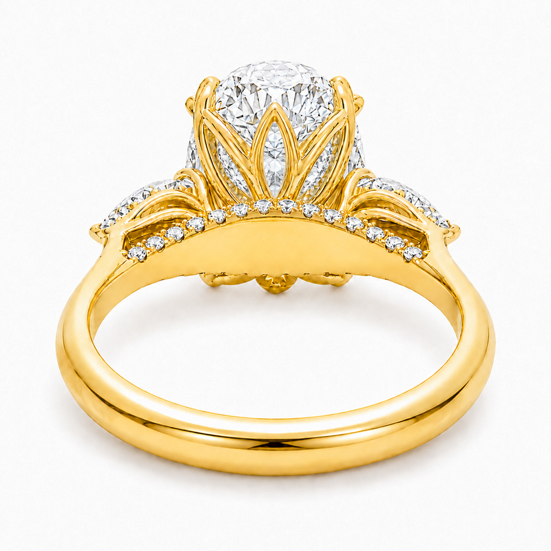 Oval three stone engagement ring with oval lab grown diamond, double claw prongs, tulip basket, and pear side diamonds