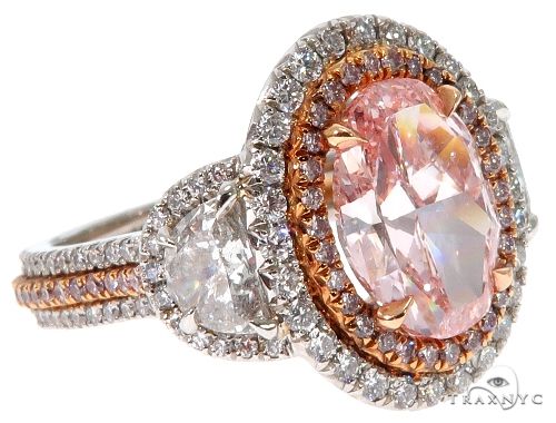Oval cut fancy pink diamond halo engagement ring with trapeze shoulder diamonds – top-down view