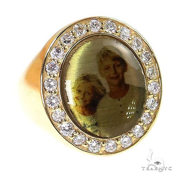 Yellow gold men's ring with oval photo center surrounded by round diamonds.
