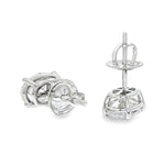 Pair of oval diamond stud earrings with cluster setting in white gold prong mount