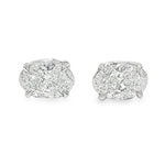 Pair of oval diamond stud earrings with cluster setting in white gold prong mount

