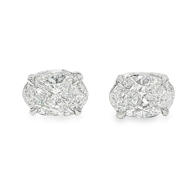 Pair of oval diamond stud earrings with cluster setting in white gold prong mount

