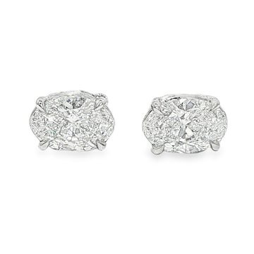 Pair of oval diamond stud earrings with cluster setting in white gold prong mount

