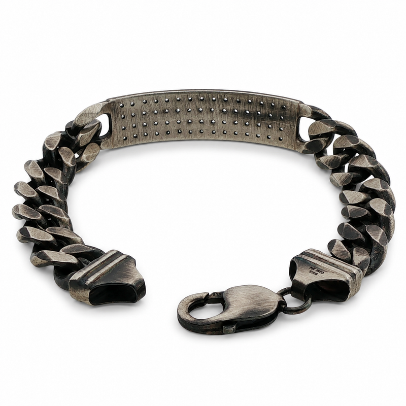 Oxidized silver men's bracelet with diamond-studded rectangular plate and chunky chain links.