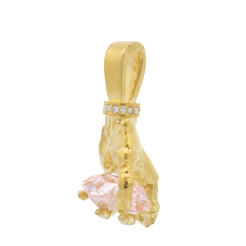 Gold hand pendant with pink diamond and small white diamonds on bail.