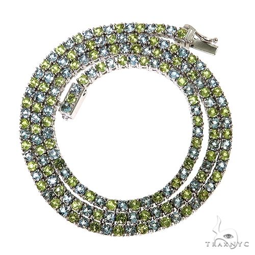 Yellow gold tennis chain with alternating peridot and aquamarine gemstones, unisex design