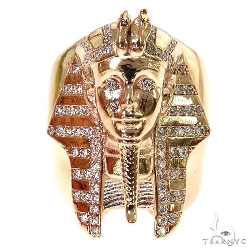 Yellow gold Pharaoh ring with detailed face and pyramid-shaped headdress studded with stones
